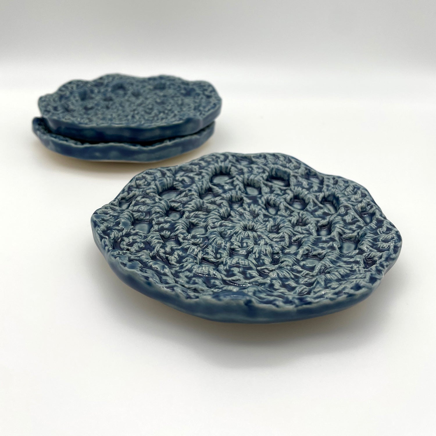 Ceramic jewelry catch-all tray featuring a handcrafted crochet-inspired design for elegant storage
