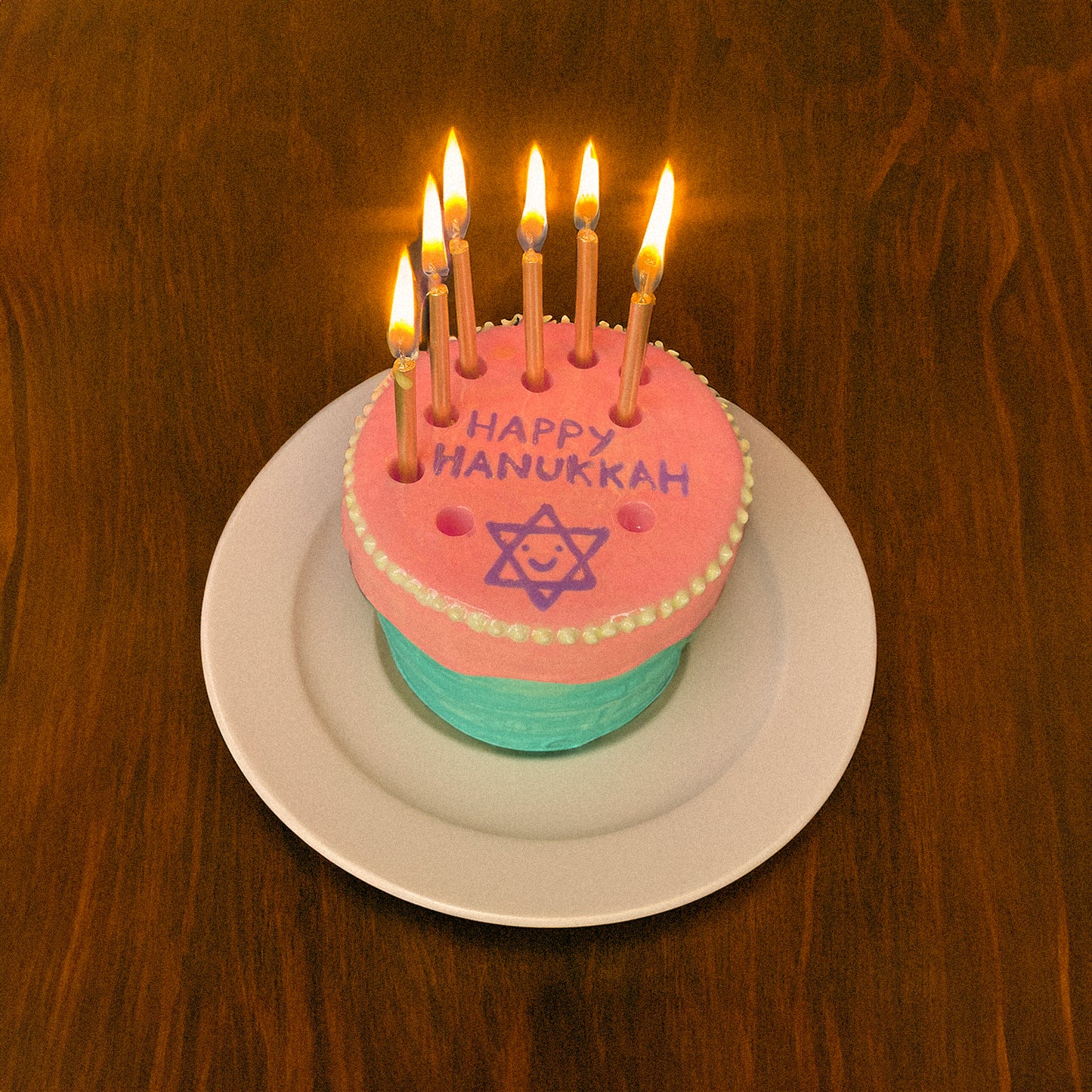 Colorful Hanukkah menorah cake for kids shaped like a fun birthday cake menorah candelabra hanukkiah