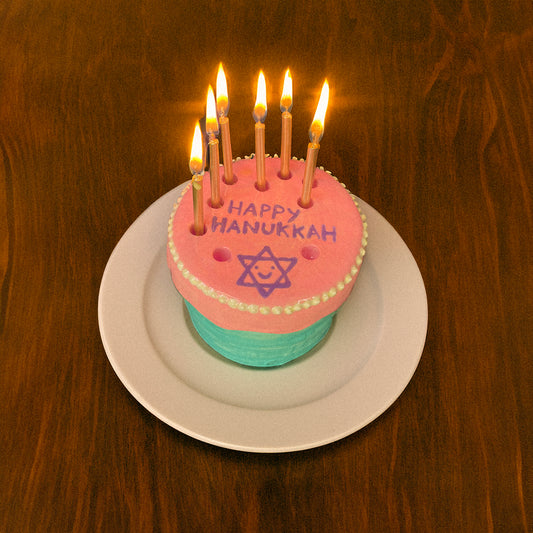 Colorful Hanukkah menorah cake for kids shaped like a fun birthday cake menorah candelabra hanukkiah