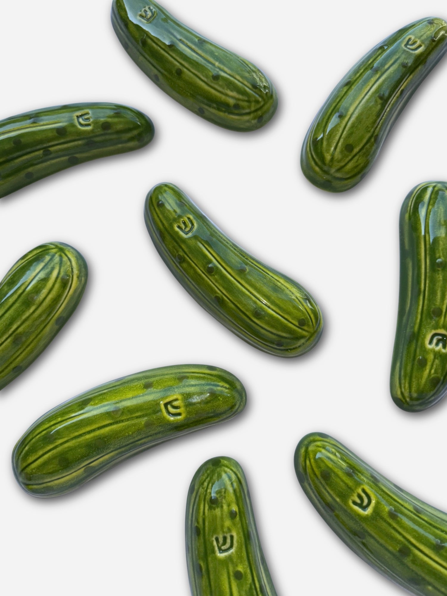 Assorted green dill pickle mezuzahs for unique Jewish gifts
