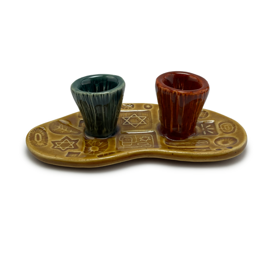 Jewish pottery shabbat candle holder for candlesticks, ceramic handmade sabbath day candle stand holder for jewish sabbath, handmade pottery for judaism shabbat judaica store and jewish gifts. Handcrafted jewish art by judaica artist Shana Ostrowiecki in California, made in the usa. Handpainted and one of a kind teal blue burnt orange mustard yellow