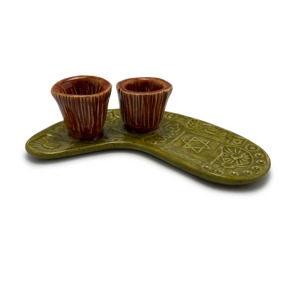 Jewish pottery shabbat candle holder for candlesticks, ceramic handmade sabbath day candle stand holder for jewish sabbath, handmade pottery for judaism shabbat judaica store and jewish gifts. Handcrafted jewish art by judaica artist Shana Ostrowiecki in California, made in the usa. Handpainted and one of a kind burnt orange olive green