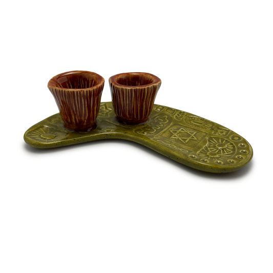 Jewish pottery shabbat candle holder for candlesticks, ceramic handmade sabbath day candle stand holder for jewish sabbath, handmade pottery for judaism shabbat judaica store and jewish gifts. Handcrafted jewish art by judaica artist Shana Ostrowiecki in California, made in the usa. Handpainted and one of a kind burnt orange olive green