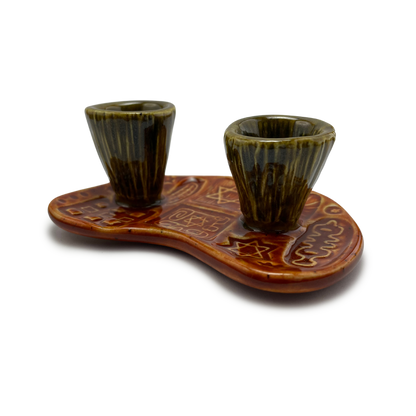 Jewish pottery shabbat candle holder for candlesticks, ceramic handmade sabbath day candle stand holder for jewish sabbath, handmade pottery for judaism shabbat judaica store and jewish gifts. Handcrafted jewish art by judaica artist Shana Ostrowiecki in California, made in the usa. Handpainted and one of a kind burnt orange olive green