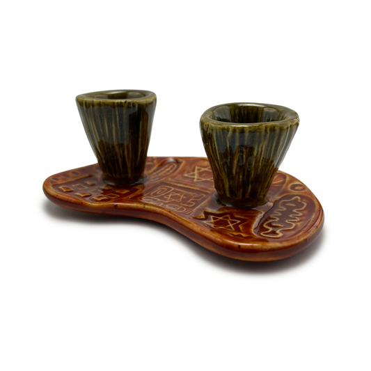 Jewish pottery shabbat candle holder for candlesticks, ceramic handmade sabbath day candle stand holder for jewish sabbath, handmade pottery for judaism shabbat judaica store and jewish gifts. Handcrafted jewish art by judaica artist Shana Ostrowiecki in California, made in the usa. Handpainted and one of a kind burnt orange olive green