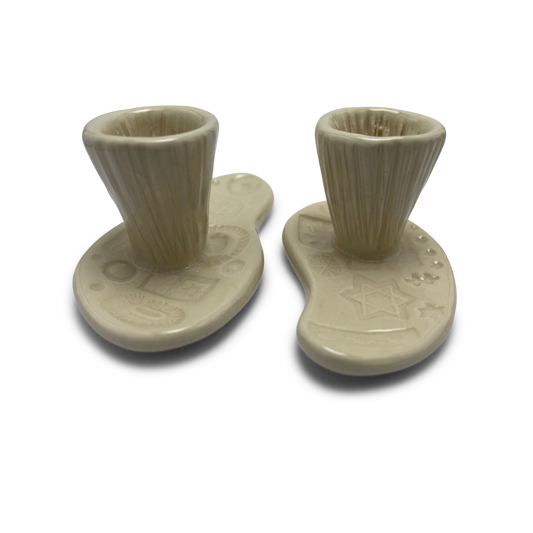 Jewish pottery shabbat candle holder for candlesticks, ceramic handmade sabbath day candle stand holder for jewish sabbath, handmade pottery for judaism shabbat judaica store and jewish gifts. Handcrafted jewish art by judaica artist Shana Ostrowiecki in California, made in the usa. Handprinted and one of a kind off white cream