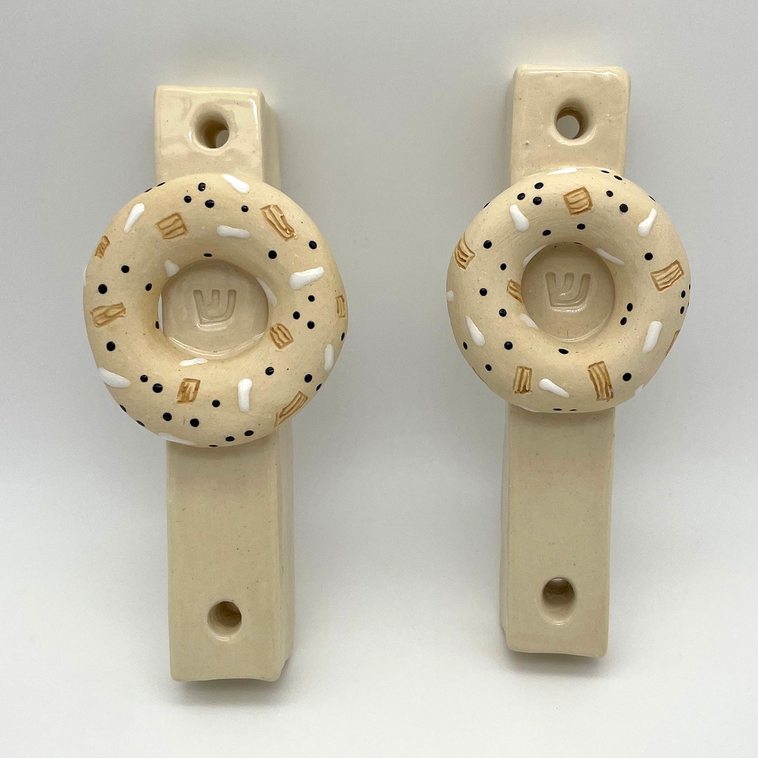 Artisan-made bagel mezuzah – a decorative and meaningful Jewish home decor item, perfect for collectors and special occasion gifts.