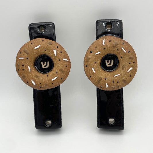 Bagel mezuzah mounted on a doorpost – fun and meaningful Jewish gift for Bar Mitzvahs, Bat Mitzvahs, and birthday celebrations.