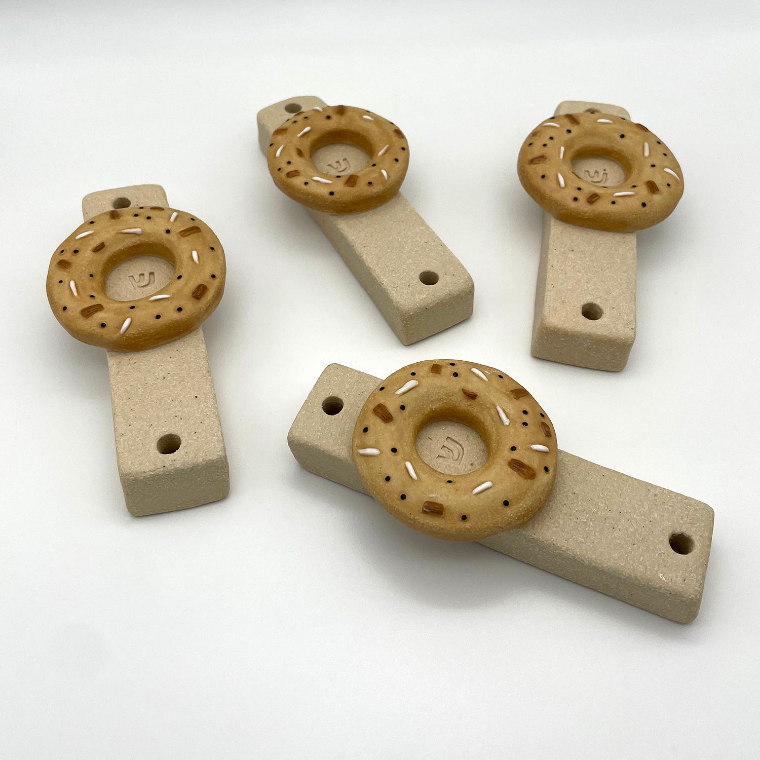 Unique bagel mezuzah mounted on doorpost – perfect Jewish home decor for housewarming gifts.