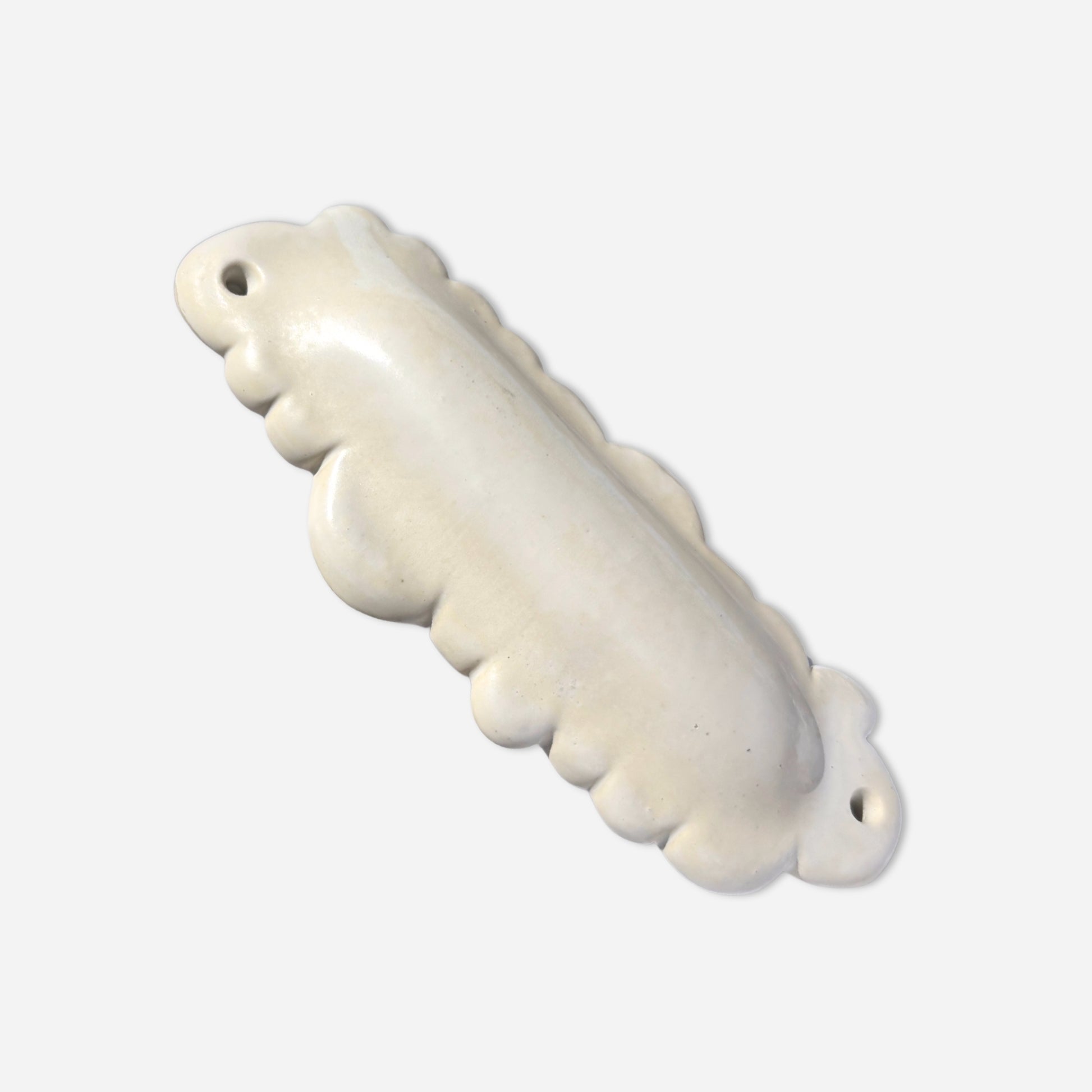 minimalist cloud-shaped mezuzah handmade from ceramic with soft rounded form and subtle glaze variation