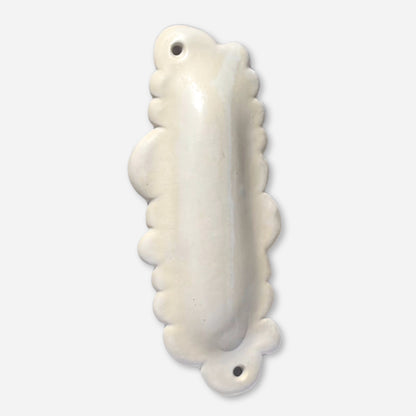 handmade ceramic cloud mezuzah case in glossy off-white glaze with scalloped edges and mounting holes