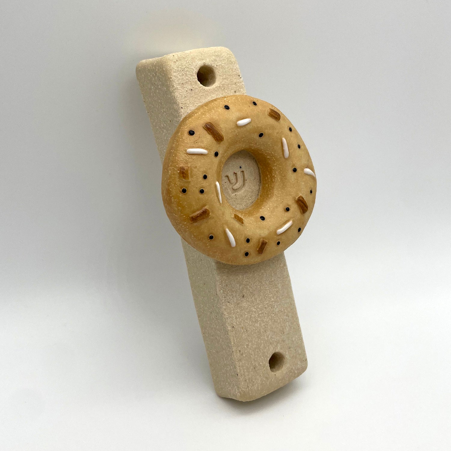 Handmade ceramic bagel mezuzah – unique Jewish mezuzah with everything bagel design, perfect for collectors.