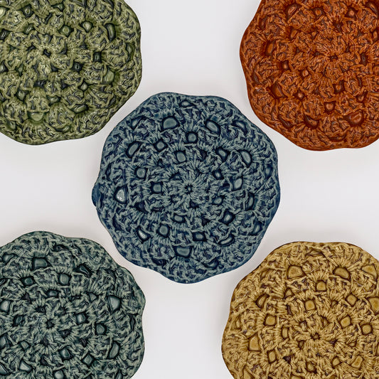 Handmade ceramic ring dish with unique crochet texture, perfect for jewelry storage and display