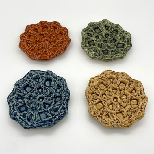 Handmade ceramic ring dish with unique crochet texture, ideal for jewelry storage and display