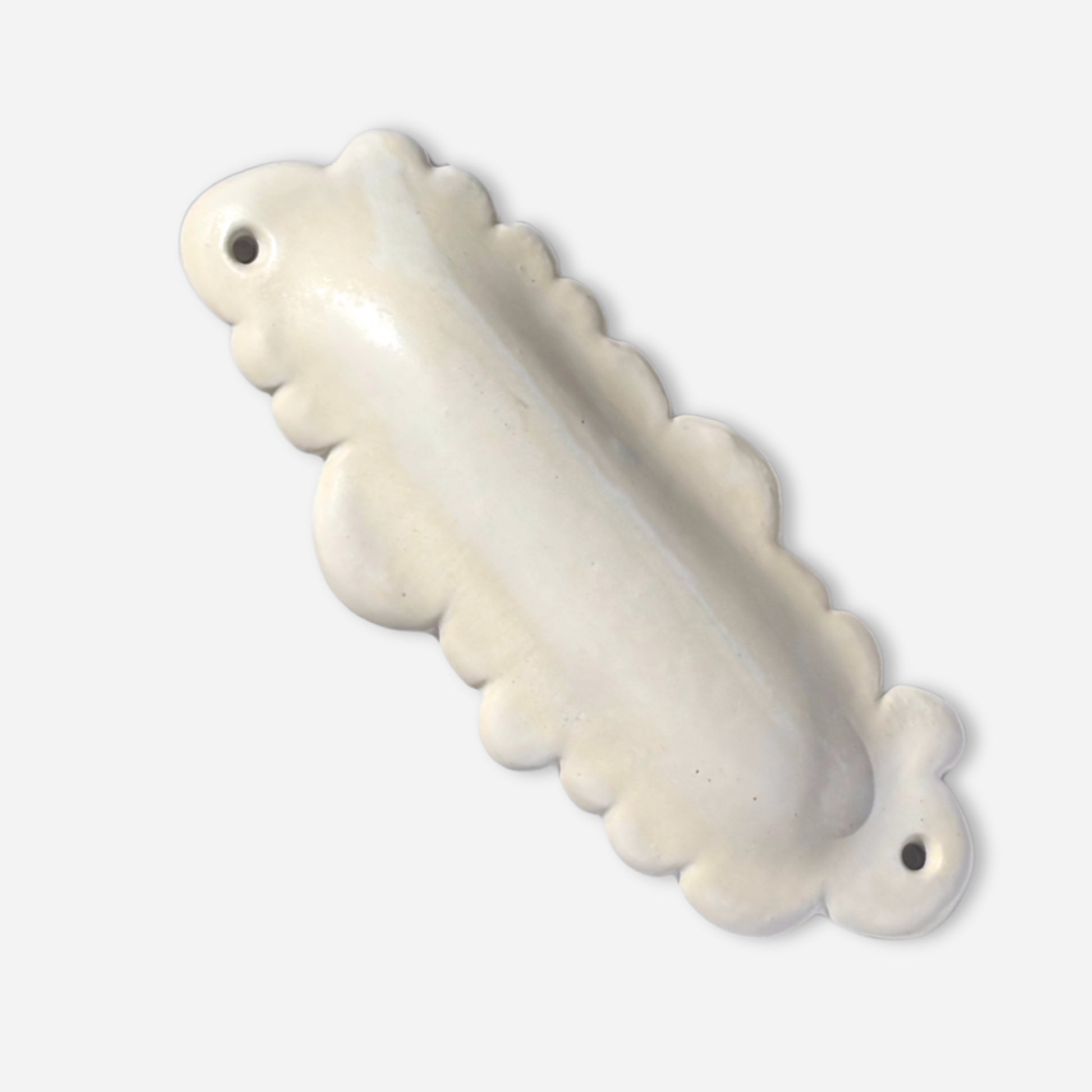 off-white glazed ceramic mezuzah in playful cloud silhouette with organic scalloped edges