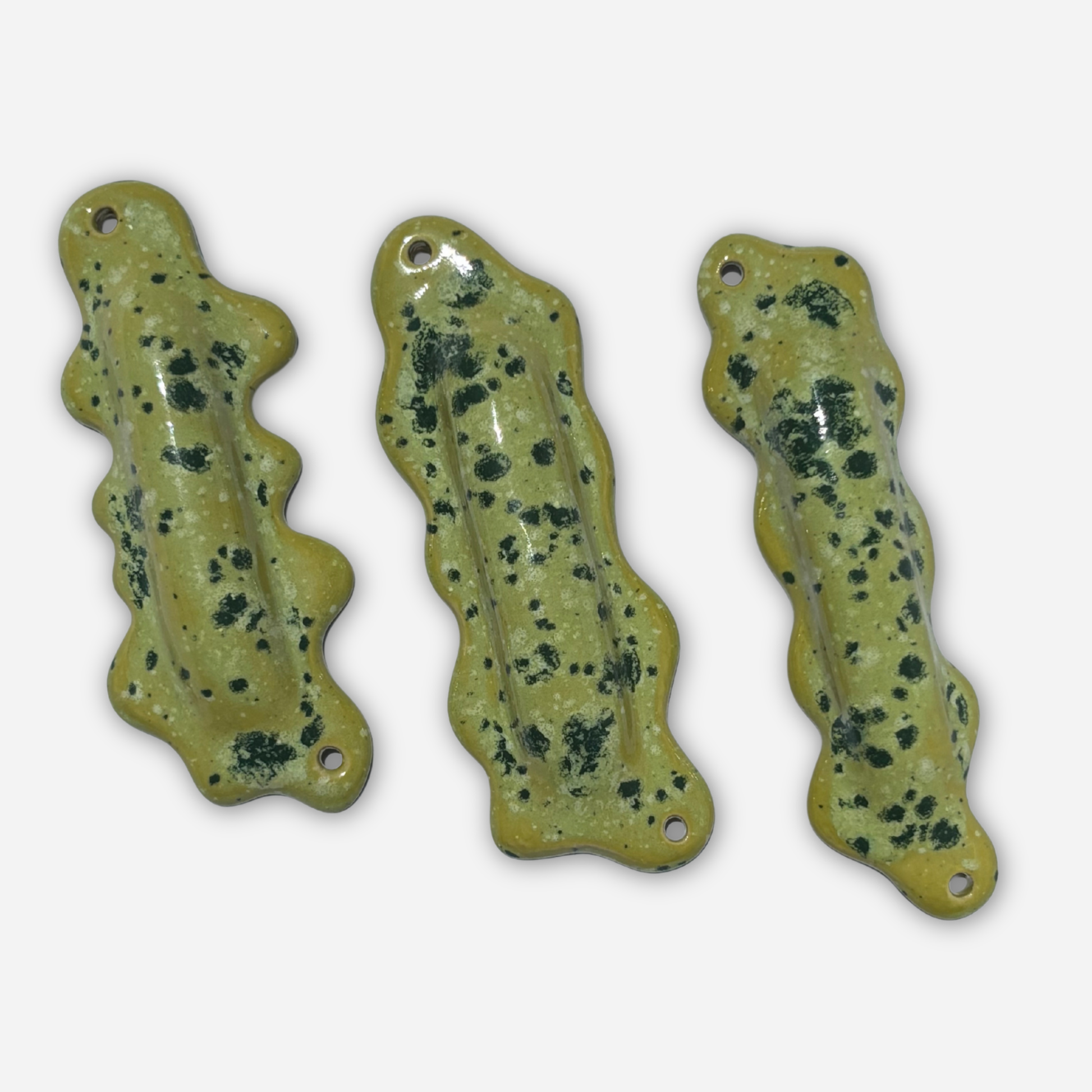 multiple sculptural mezuzah cases ceramic wavy forms bright green speckled glaze modern judaica