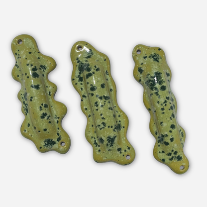 multiple sculptural mezuzah cases ceramic wavy forms bright green speckled glaze modern judaica