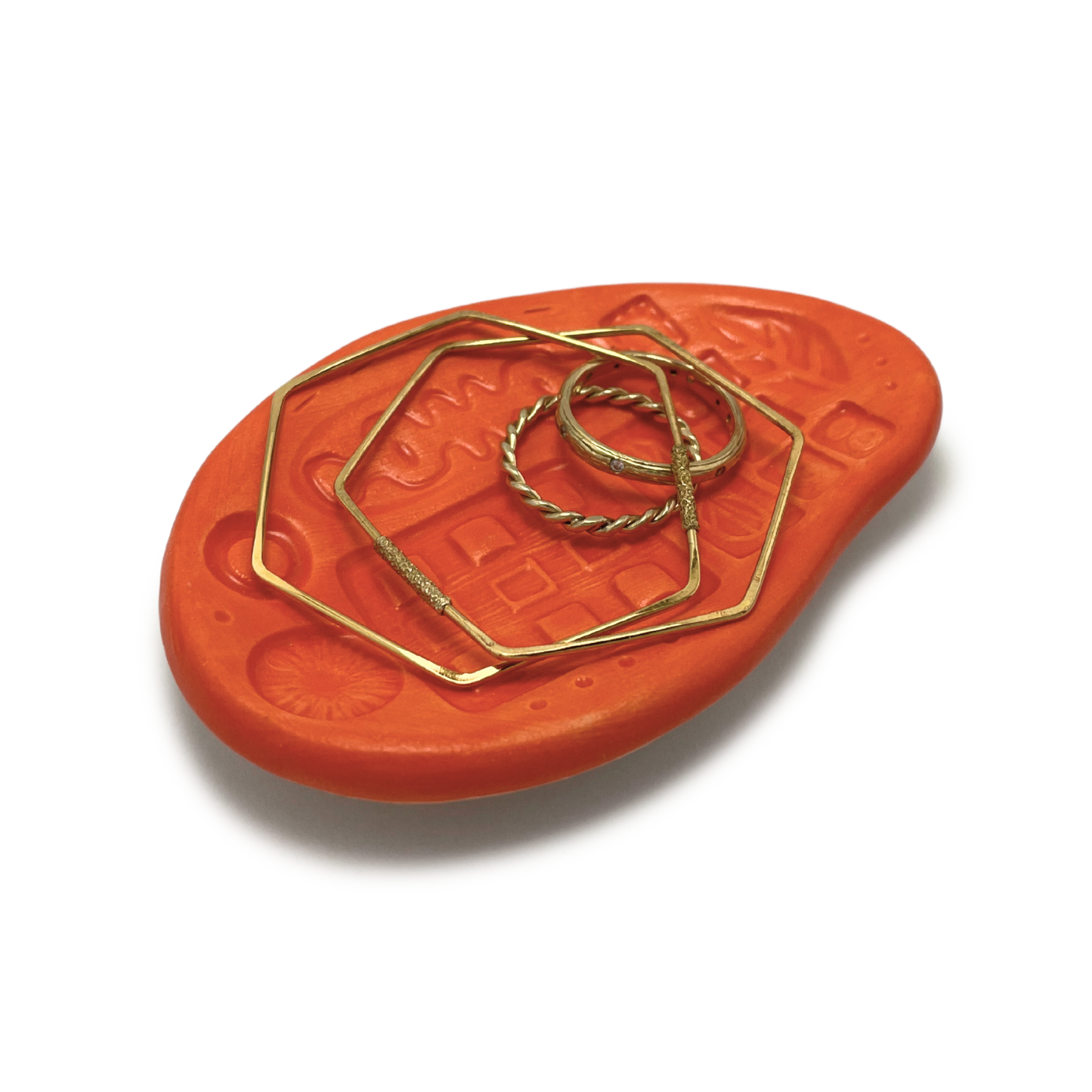 small handmade trinket dish or jewelry ring holder bright orange pattern texture one of a kind