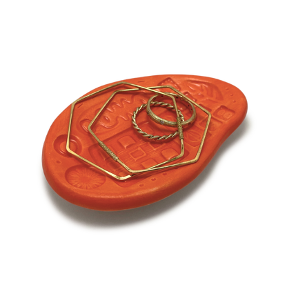 small handmade trinket dish or jewelry ring holder bright orange pattern texture one of a kind