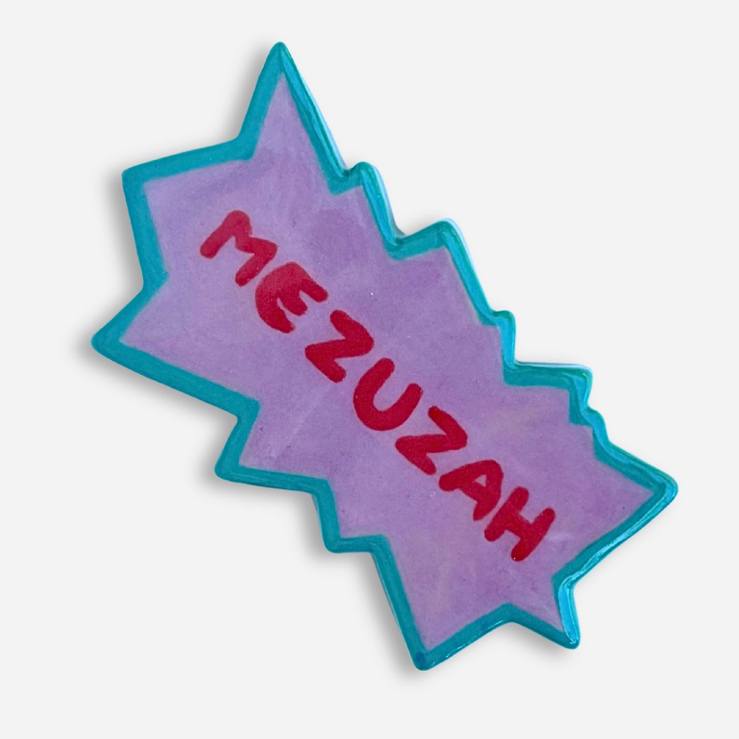 Small handmade mezuzah case shaped like a 90s cartoon title card explosion in teal and purple. Rugrats Nickelodeon style 
