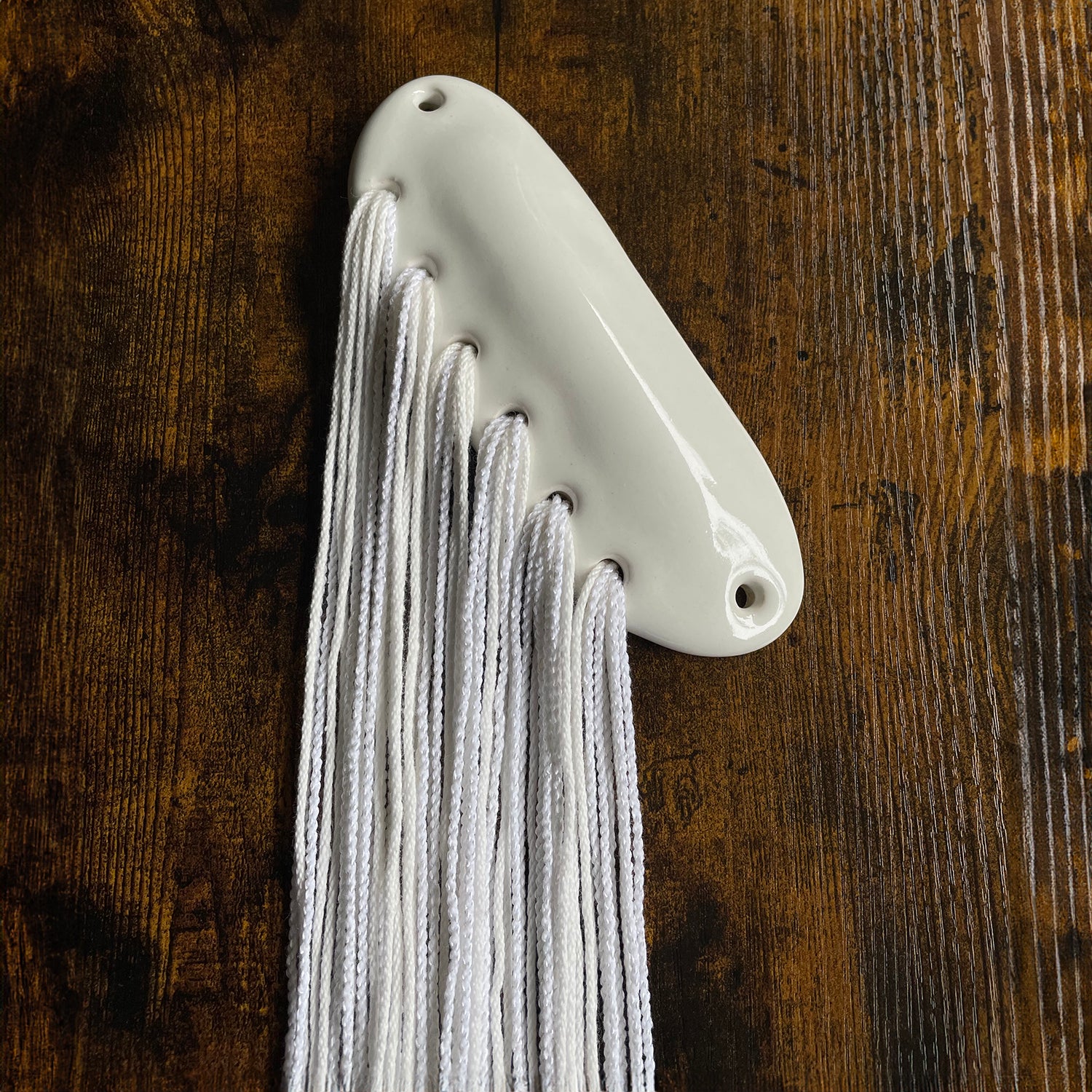 ceramic mezuzah white gloss glaze organic abstract handmade mezuzot with textiles. fiber art mezuzahs by shana ostrowiecki